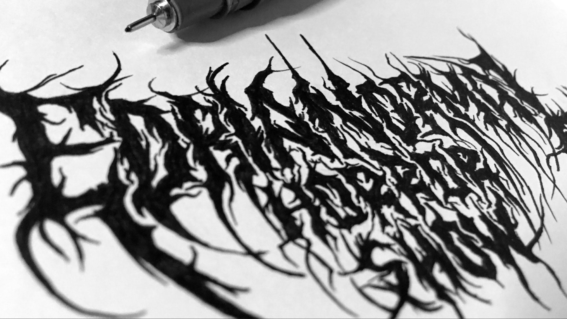 Boceto a mano en tinta del lettering